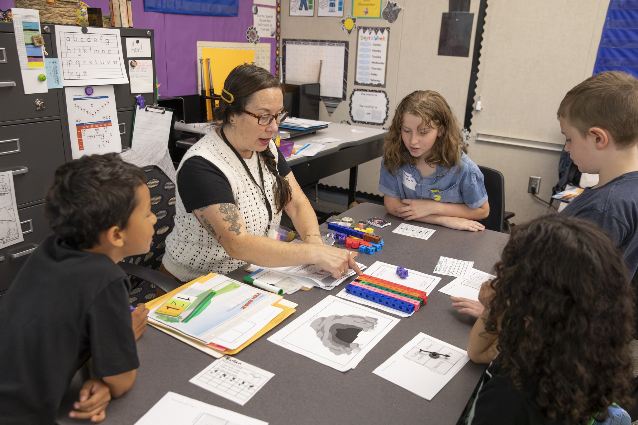 A teacher and students engaging in a lesson